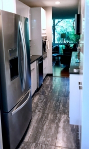 new refrigerator with white kitchen cabinets
