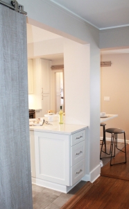 white kitchen cabinets with hardwood floors